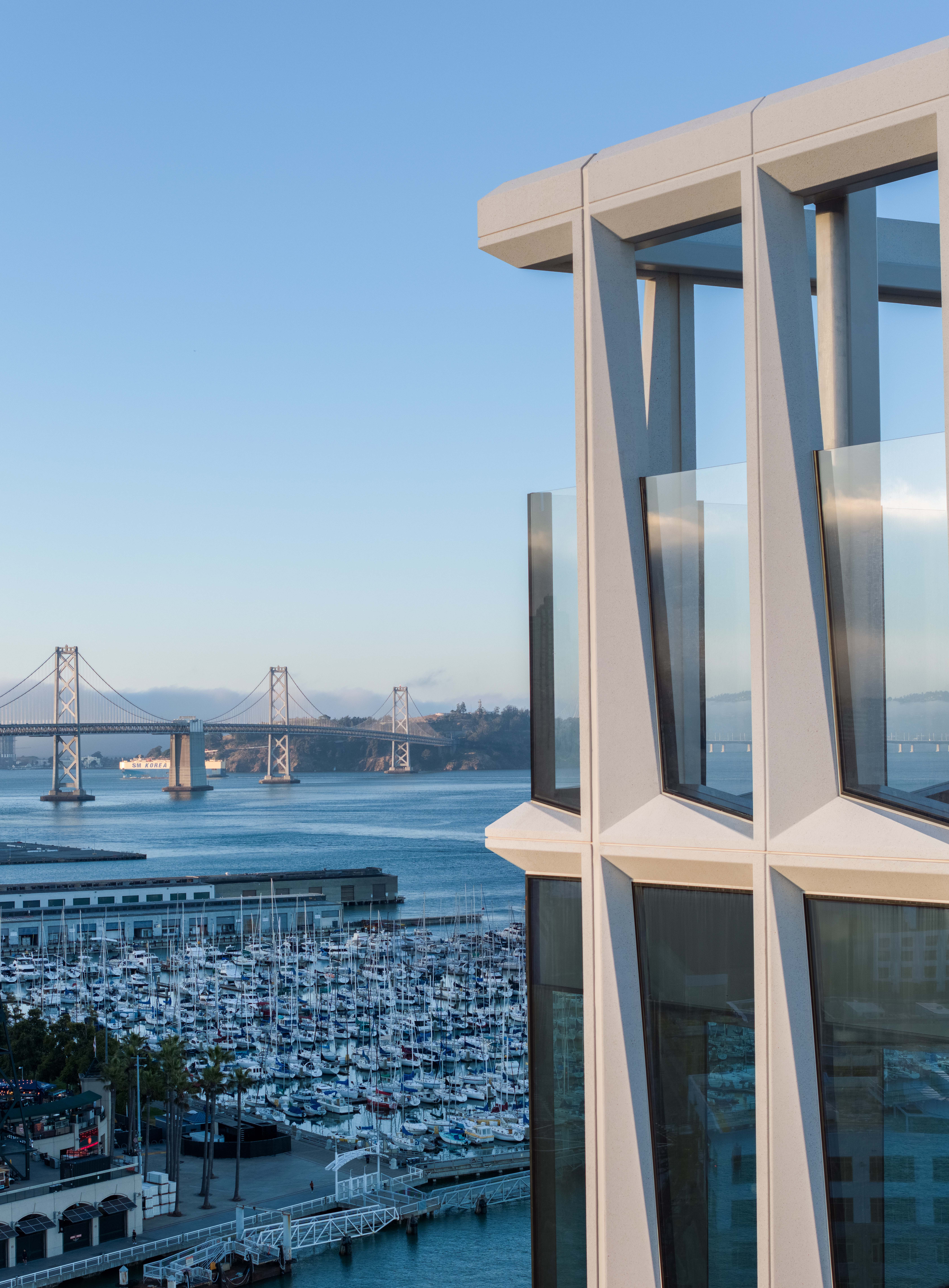 Modern building overlooking bridge and marina