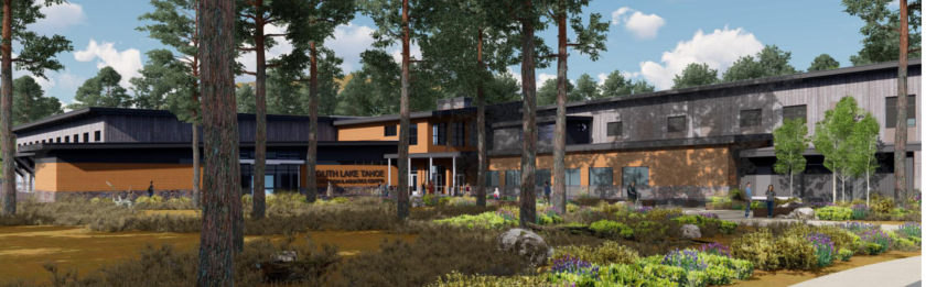 Modern building surrounded by trees and garden landscape.